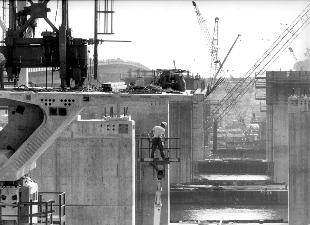 Ironworker on a concrete bridge pier during construction, historic O&G Industries jobsite