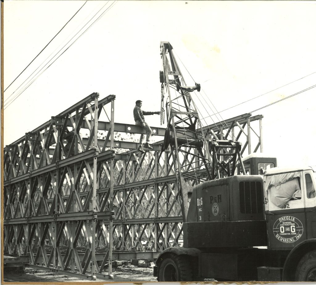 O&G Industries crew erecting steel bridge girders with a P&H crane, historic photo